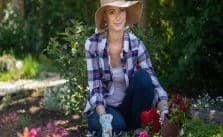 Woman gardening with her hat on